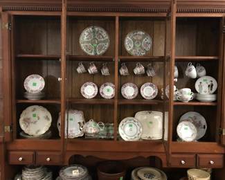Chinese Rose Medallion plates top center, desert plates,  cups & saucers, tea pot, and other serving pieces. 