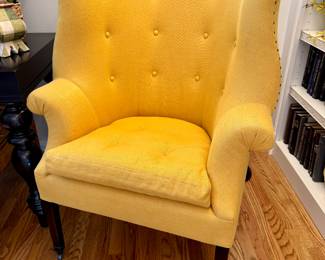 $400. Tufted butterfly wingback with down seat cushion. Metal castors.  This image makes the color look faded - the color is consistent! 34 x 28 x 43H