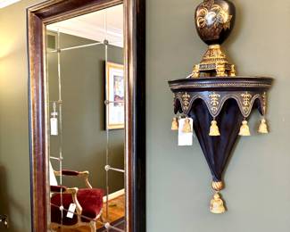 $350 - Decorative wall mirror with medallions and painted frame - 40.5x90; $100 - Ornate wall scones with black and gold finish and tassel detail (oversized)- 18x25; $68 - Black and gold lidded Raymond Waites urn