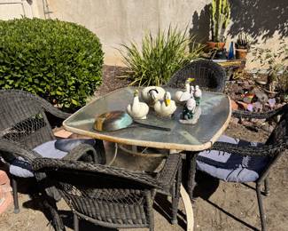 4 piece wicker chairs and glass table