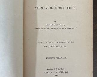 Two antique Lewis Carroll classics — Alice’s Adventures in Wonderland (1893) and Through the Looking-Glass (circa 1891), both illustrated by John Tenniel. Original gilt-decorated red and blue cloth covers. Printed in New York by Macmillan.
