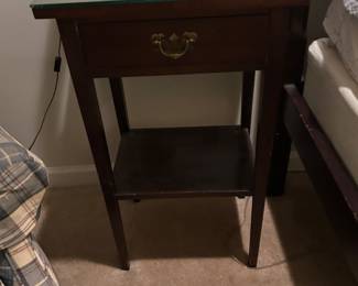 a pair bedside tables by Newcomb Reproductions.