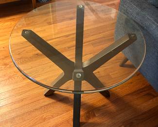 A pair of glass top side tables.
