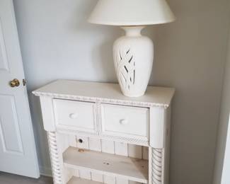 2-drawer bookcase; table lamp