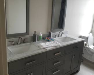 Updated bath vanity; mirrors; vanity light