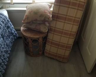 Rattan accent table; cushions