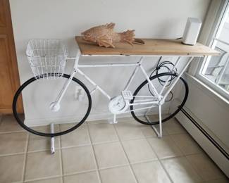 Bicycle foyer table; wooden fish. Does a fish need a bicycle? Maybe!