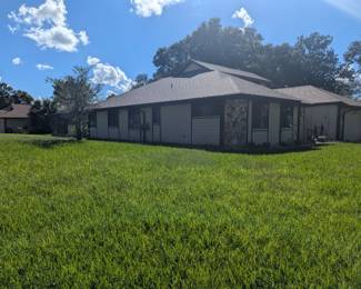 Side view of the house. Large four bedroom roughly 3,000 ft with a beautiful pool
