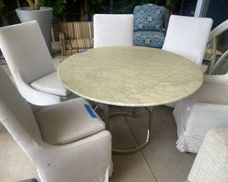 Two different items in this photo you have a marble with a metal base
Six restoration hardware slip covered chairs