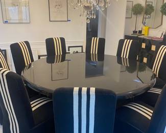 Stone dining table and 10 custom chairs
78” x 29”