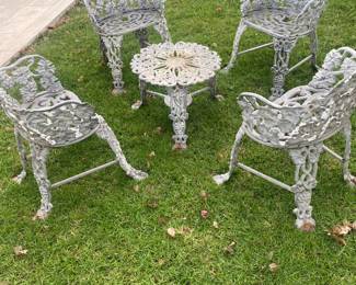 Petite antique iron, iron patio chairs, and table