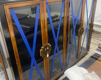 Wood buffet brass handles top to a China cabinet or display cabinet. The base is shown in another photo.