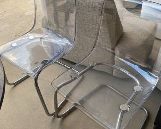 Two lucite and chrome chairs