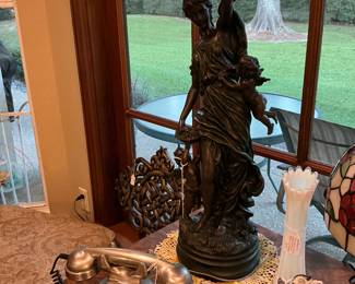 Silvertone heavy phone with push buttons, an Edmonton Augustin bronze statue