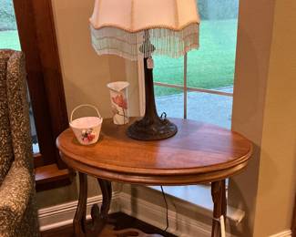 a parlor table Tiger Oak with the Tiffany style lamp with a fringe shade