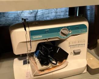 A brother, sewing machine, with various attachments