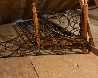 This is a nice iron scroll wooden day bed with a trundle
