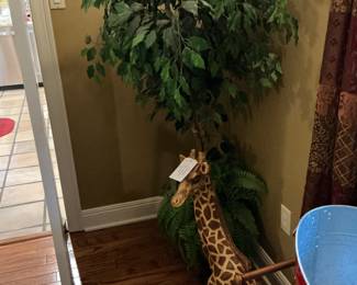 Another beautiful little piece made into a giraffe with a faux tree behind it