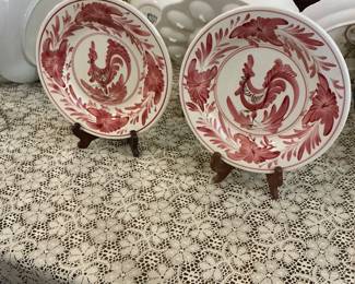 Hand-painted roosters on a plate