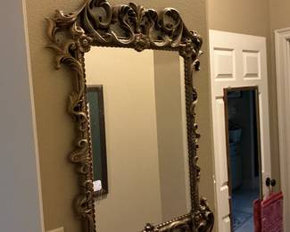 This is a plastic style ornate mirror