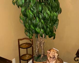 to the left is a pot tray with painted hummingbirds, beautiful faux tree, the statue of the cat is just beautiful