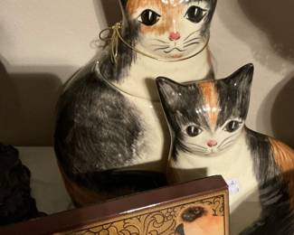 a pair of porcelain cats