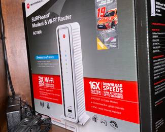 This is a surfboard, modem, and Wi-Fi router, new inbox