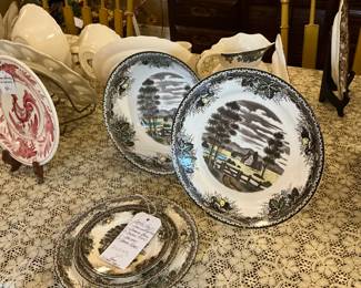 a collection of English style plates