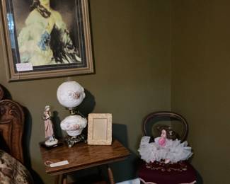 in the corner Victorian needlepoint chair 1950s doll rose, gone with the wind lamp sitting on a tiger Oak side table