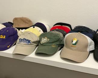 Various collection of golf course hats