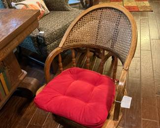 This is a cane back swivel Oak office chair
