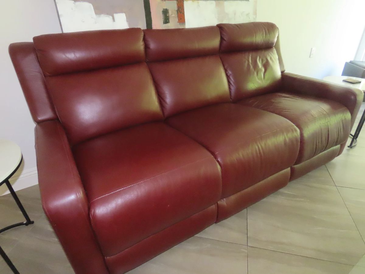 Dual power reclining sofa, red leather.