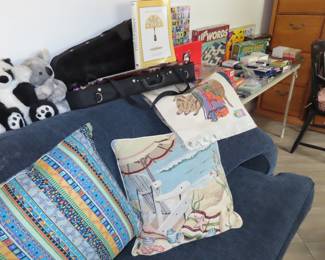 Thrwo pillows, sleeper loveseat, toys. playing cards, jigsaws and board games,