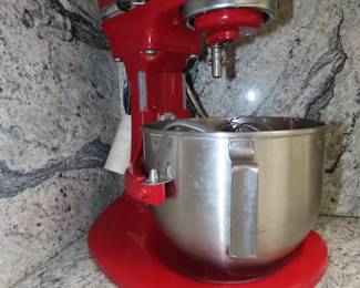 KitchenAid Pro 450 Mix Master on stand with attachments.