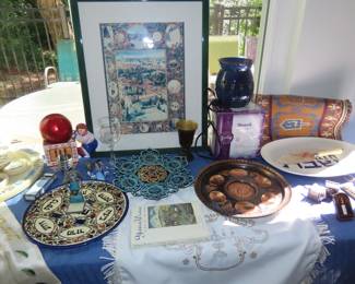 Judaic table, Menorahs, Seder plates, candles, goblets, linens, colored glass pieces, soft toys, artwork.