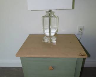 Two drawer nightstand and glass table lamp.