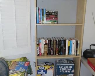 Tall bookcase and books.