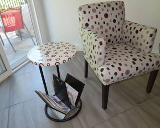 Two matching polka dot armchairs. with matching end table/magazine rack.