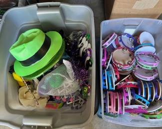Containers full of holiday decor and tambourines.
