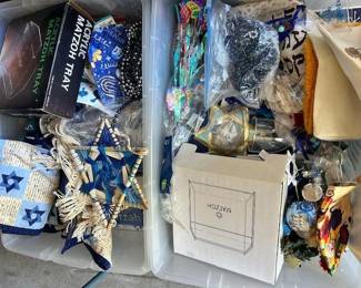 Containers full of Channukah decorations and other Judaic decor.