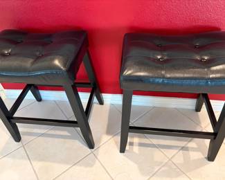 Two faux leather bar stools 