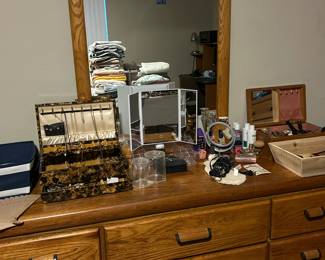 Various costume jewelry items include necklaces, earrings, pins, bracelets and rings