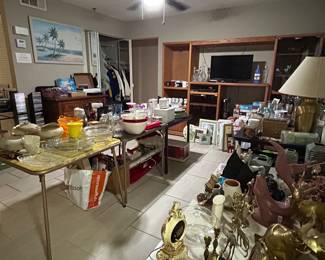Tables full of housewares, dishes, glassware, accessories