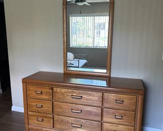 Oak horizontal dresser with 9 drawers and attached mirror