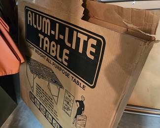 Two Alum-i-Lite folding tables (in original boxes)