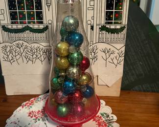 Glass ball ornaments in plastic tree