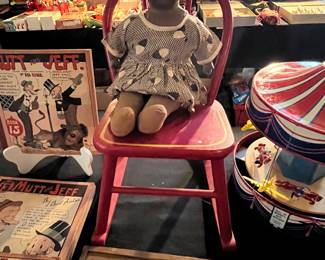 1920’s black baby doll
Little red chair