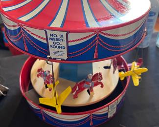 Wolverine toy merry go round w metal horses and flying planes musical works
