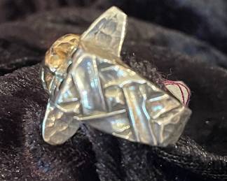 Dian Malouf side of cross ring