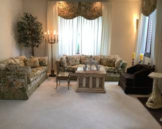 Setting of furniture ….sofa and loveseat, candle sticks, candlestick light, crown chair, 